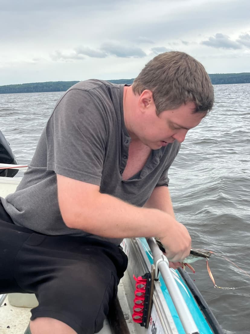 Aleksi fishing on a lake